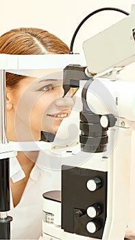 Ophthalmologist doctor in exam optician laboratory with female patient. Eye care medical diagnostic. Eyelid treatment