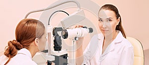 Ophthalmologist doctor in exam optician laboratory with female patient. Eye care medical diagnostic. Eyelid treatment