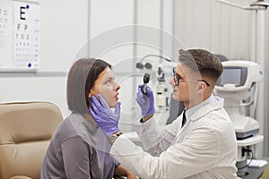 Ophthalmologist Examining Young Woman