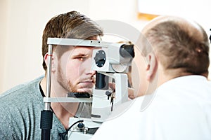 Ophthalmologist or optometrist optician at work