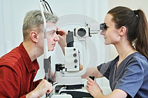 Ophthalmologist or optometrist optician at work. BeH3althy