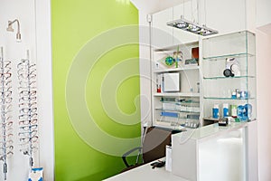 Ophthalmologist's workplace with spectacle frame and other work equipment