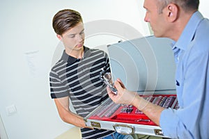 Ophthalmologist showing one lens