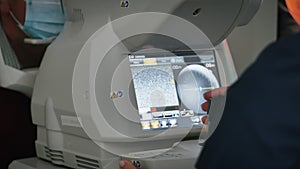 Ophthalmologist specialist exames eyesight vision using modern medical equipment