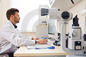 Ophthalmologist Working with Computer in Office