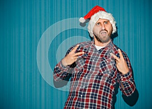 The opinionated christmas man wearing a santa hat photo