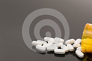 Opiod pills spilled out on table
