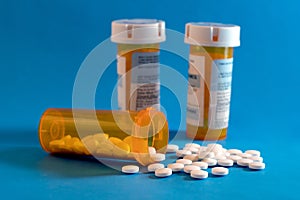 Opioid Crisis - Open Bottle of Prescription Painkillers. Medicare, overdose.