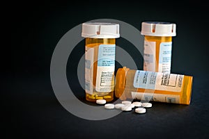 Opioid Crisis - Open Bottle of Prescription Painkillers. Medicare, overdose.