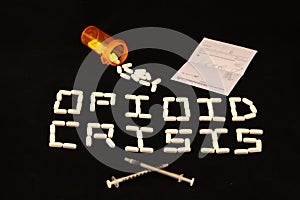 Opioid Crisis spelled out, prescription, pills and needles photo