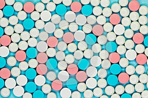 Opioid painkillers crisis and drug abuse concept. Different kinds of multicolored pills. Pharmaceutical medicament background
