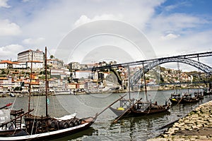 Oporto city, Luiz 1st bridge and boats with Port wine