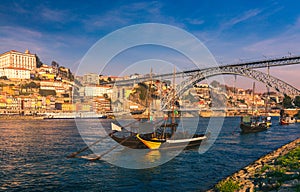 Oporto or Porto city skyline, Douro river, traditional boats and Dom Luis or Luiz iron bridge. Porto, Portugal, Europe