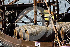 Oporto, Portugal: detail of rabelo boat with barrels of Port wine