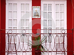 Oporto tipical balcony house with catolic figure photo