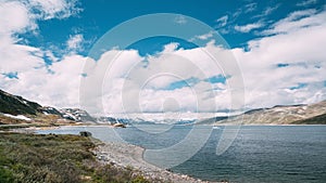 Oppland, Tyin Lake, Norway. Stones On Coast Of Beautiful Lake Tyin In Summer Day. Norwegian Nature. 4K photo