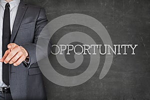 Opportunity on blackboard with businessman