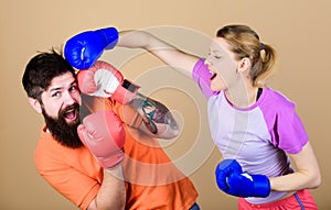 Opportunity may knock. knockout and energy. couple training in boxing gloves. Happy woman and bearded man workout in gym