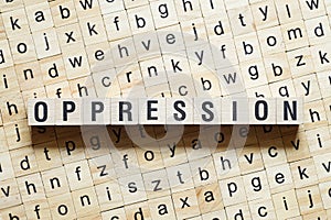 Oppression word concept on cubes photo
