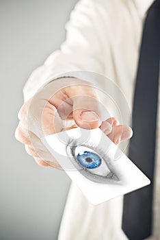 Opthalmologist giving his visiting card