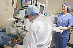 Opthamologist Performing Laser Eye Treatment photo