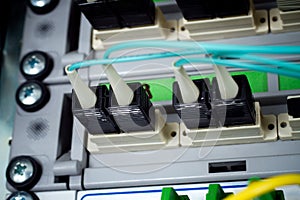 Optic fiber cables connected to a switch