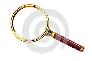 Optic magnifier and examine small details conceptual idea with brass magnifying glass with wooden handle isolated on white