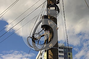 Optical cables hanging on a power pole