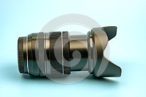 Optical digital camera lens isolated on blue background