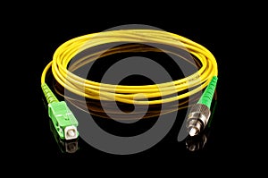 Optical fiber cable isolated on the black background