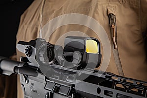 Optical sight on a modern automatic carbine. Reflex sight mounted on the weapon