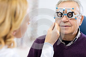 Optical specialists precisely determines diopter to senior patient
