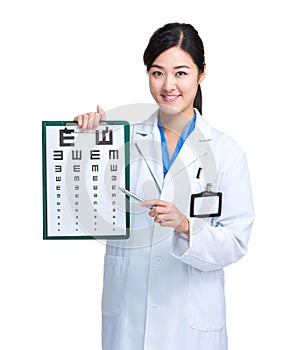 Optician doctor with eye chart and pen