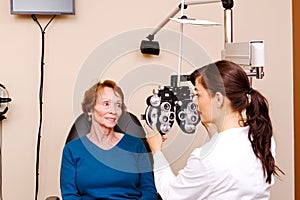 Optician explaining tests to senior