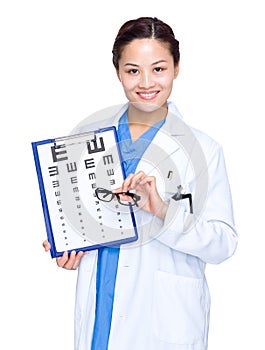 Optician hold with eye chart and glasses