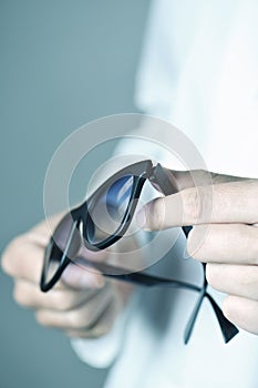 Optician man with a pair of sunglasses