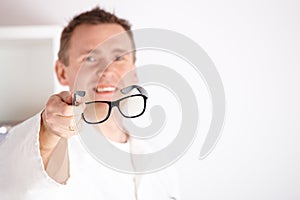 Optician offering glasses