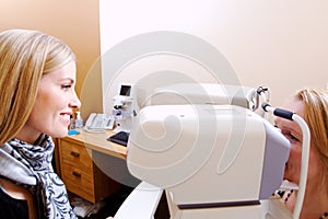 Optician preparing client for tonometer test