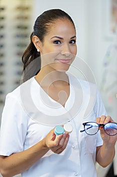 optician showing frames and lens