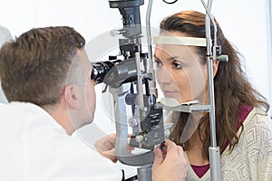 Optician testing female patient