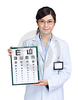 Optician woman showing eye exam chart