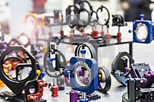 optics and laser holders and motorized positioners on the optical table