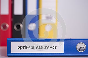 Optimal assurance on blue business binder photo