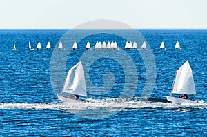 Optimist sailboat during a training photo