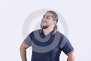 An optimistic and auspicious man looking up and smiling. Thankful and appreciating his blessings. Recalling happy memories photo