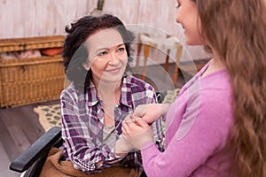 Optimistic crippled woman thanking girl