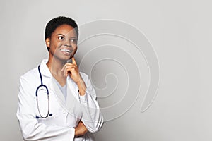 Optimistic happy doctor woman medical worker in lab coat on white background