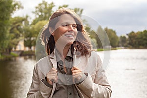 Optimistic happy joyful woman smiling in park outdoor