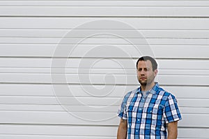 Optimistic man outdoors with a white background.