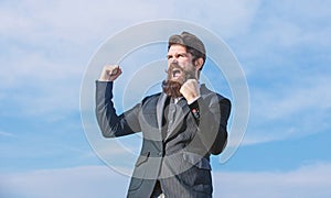 Optimistic mood. Success and luck. Being optimistic. Man bearded optimistic businessman wear formal suit sky background